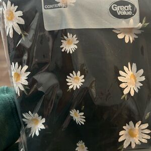 Black shower curtain with white daisy